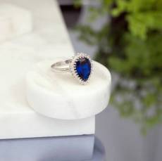 Λευκόχρυσο δαχτυλίδι ροζέτα Κ14 με μπλε πέτρα 048100